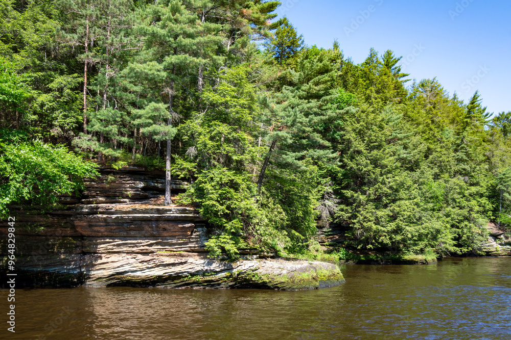 The Cambrian sandstone bluffs along the Wisconsin River in the Wisconsin Dells. The Cambrian sandstone bluffs along the Wisconsin River in the Wisconsin Dells.