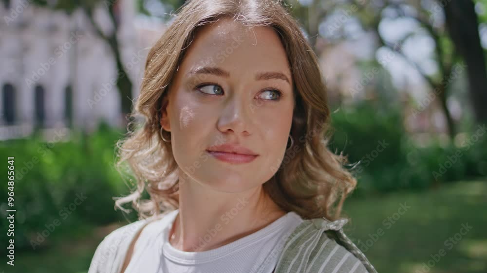 Attractive model posing park surrounded vivid greenery closeup. Portrait woman Attractive model posing park surrounded vivid greenery closeup. Portrait woman