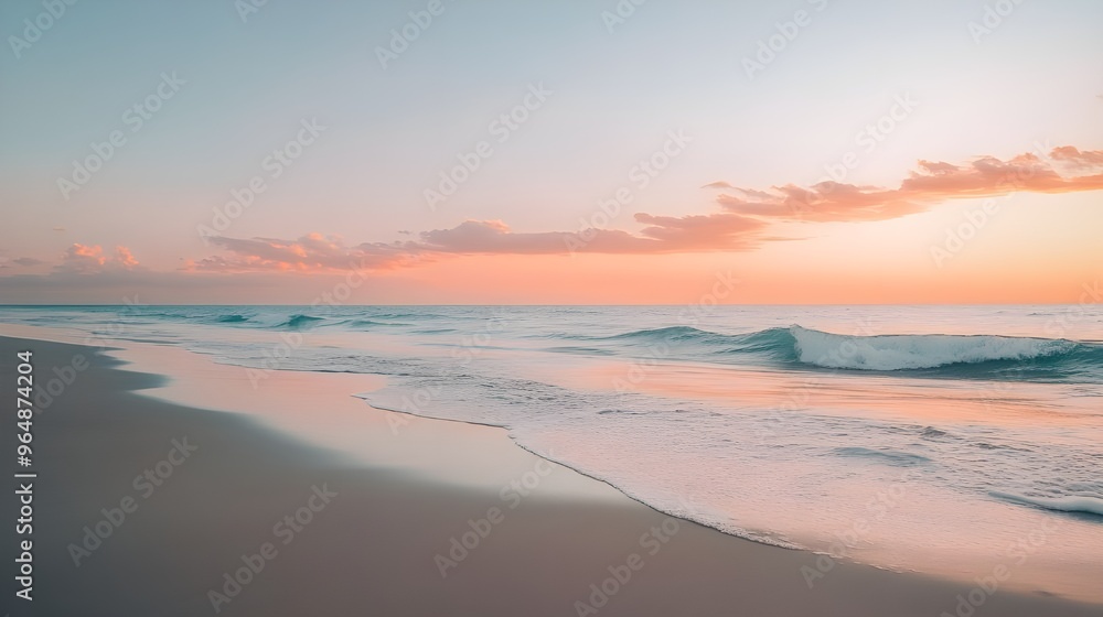 A tranquil stock photo of an empty beach with gentle waves lapping against the shore at sunset. A tranquil stock photo of an empty beach with gentle waves lapping against the shore at sunset.