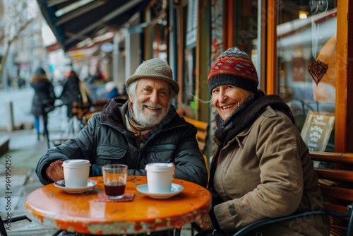 Joyful couple of travelers savoring coffee together at a charming sidewalk cafe in the city