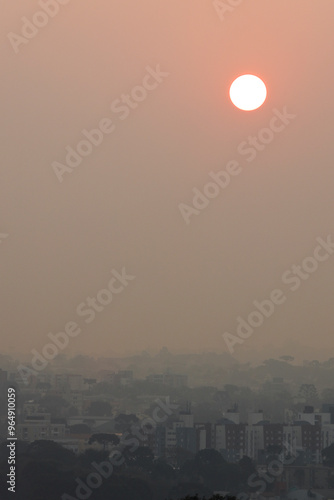 Sunset in Curitiba, State of Paraná, Brazil covered in smoke from the fires.  photo