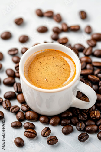 coffee mug in top view with roasted coffee beans in the backdrop