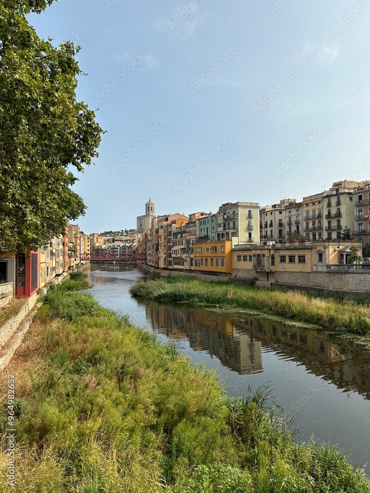 Fototapeta premium Charming Riverside Cityscape with Colorful Historic Buildings