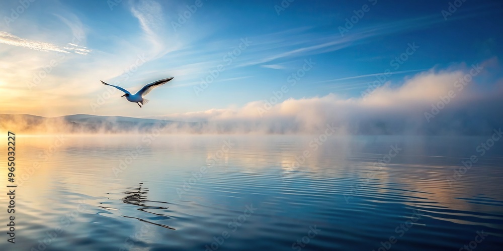 Fototapeta premium nature, dreamlike, wildlife, calm, peaceful, coastal, seagull, ripple, seaside, reflection, scenic, landscape, surreal, Sea ripple water with morning fog and flying seagull reflected