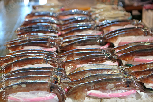 Raw squids on ice for sale at Jukdo fish market near Pohang-si, South Korea  photo