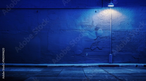 Urban Night Scene with Blue Wall and Street Light, Empty Street Photograph