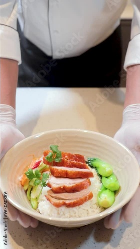 chef preparing rosted duck with rice
