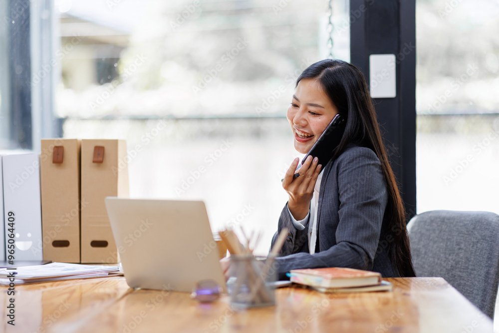 Modern Asian business woman in workplace office, doing planning analyzing the financial report, business plan investment, finance analysis concept Modern Asian business woman in workplace office, doing planning analyzing the financial report, business plan investment, finance analysis concept