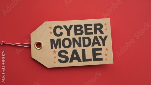 Brown kraft paper tag featuring Cyber Monday sale message, highlighted by a vibrant red backdrop