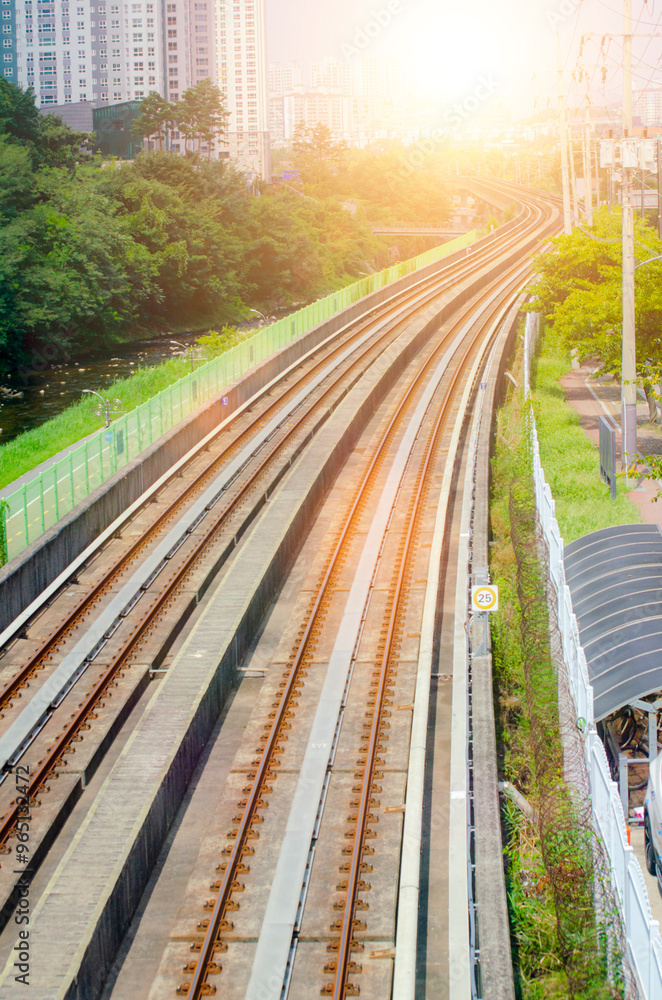 Fototapeta premium Empty train track, double Tracks with sunlight in countryside