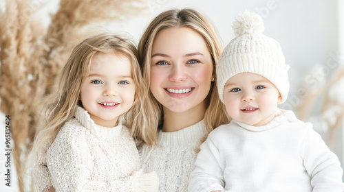 A mother and her two children are posing for a picture