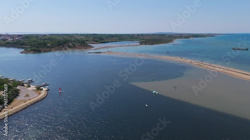 Historic Town of Nin Laguna Aerial View With Velebit Mountain Background, Dalmatia Region of Croatia. Famous Nin Lagoon Trouists Relaxing on Sandy Zdrijac Beach and Medieval in Croatia Harbour Town photo