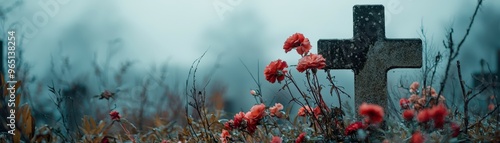 Gravestone with wilted flowers under a gray sky, mourning, quiet reflection in a cemetery photo