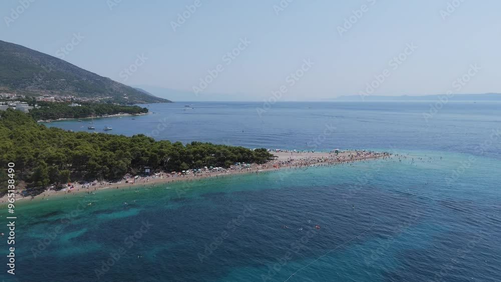 Aerial View of the Zlatni Rat Beach in Bol on Brac Island, Split Dalmatia, in Croatia. Summer Vacation Resort Golden Cape or Golden Horn. Summertime. Famous Adriatic Beach on Adriatic Sea 4K Video Aerial View of the Zlatni Rat Beach in Bol on Brac Island, Split Dalmatia, in Croatia. Summer Vacation Resort Golden Cape or Golden Horn. Summertime. Famous Adriatic Beach on Adriatic Sea 4K Video