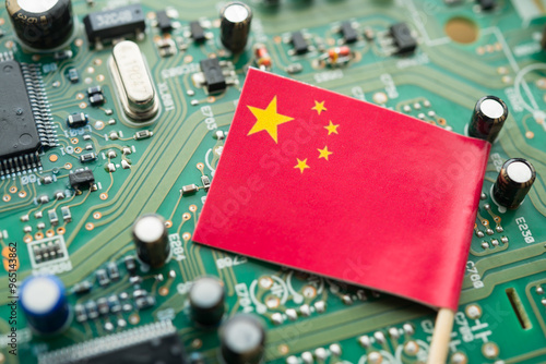 Chinese flag on green circuit board background. US vs China chip war or tech war, microchip semiconductor industrial competition concept. US restrict and control chip export to China. photo