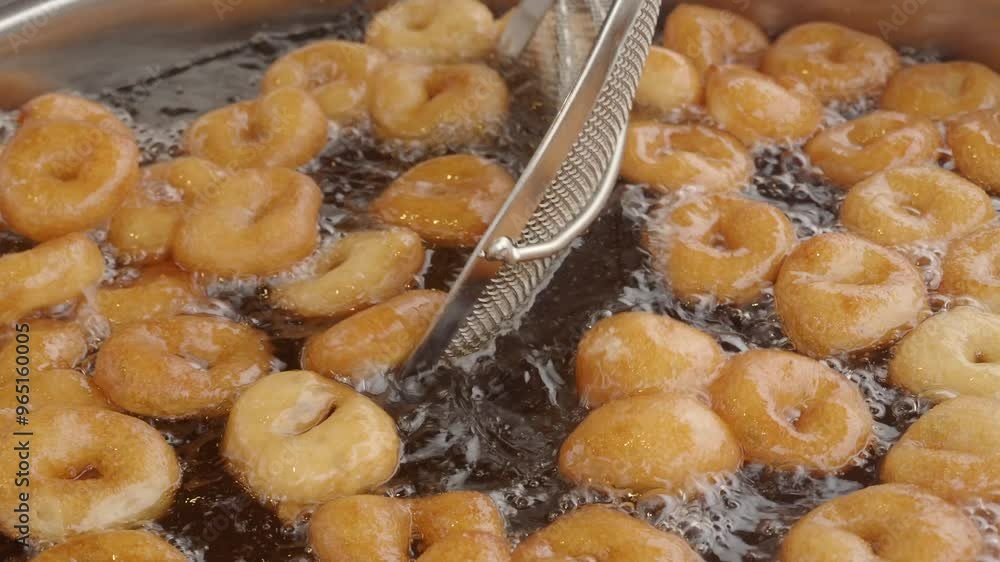 Traditional fried sweets lokma in sugar syrup Traditional fried sweets lokma in sugar syrup