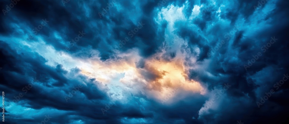 Dramatic clouds with deep blues and warm highlights create a striking sky scene, perfect for nature and weather themes. Dramatic clouds with deep blues and warm highlights create a striking sky scene, perfect for nature and weather themes.