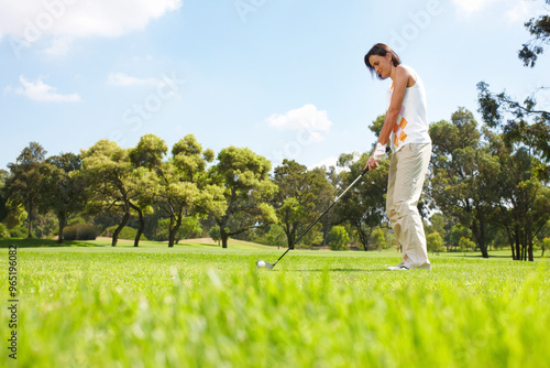 Woman, training and golf course for playing, club and outdoor fitness for competition or games. Female person, tournament and precision ball for practice match, exercise and professional athlete photo