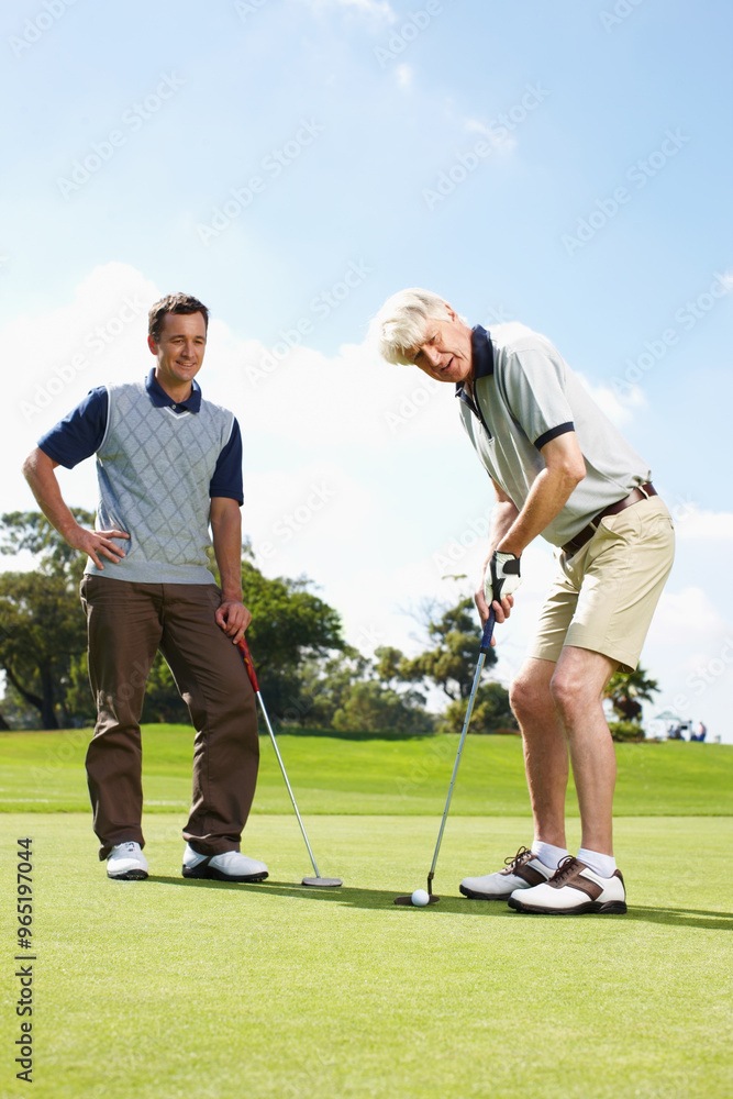 Obraz premium Game, grass and men on golf course together for teamwork, outdoor fun and fitness competition at club. Sports, senior father and son on green for partnership, bonding and support in healthy hobby.