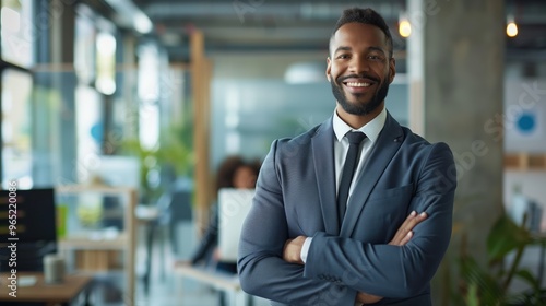 Professional Confident Businessman in Modern Office Setting - Business Leader Smiling with Arms Crossed