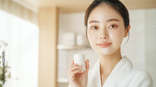 Ethereal Portrait of a Korean Model Embracing Skin Renewal with Gentle Exfoliation in Modern Bathroom Setting