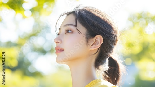 Active Lifestyle Concept - Japanese Woman Jogging in City Park, Promoting Health and Fitness with Silhouette Effect