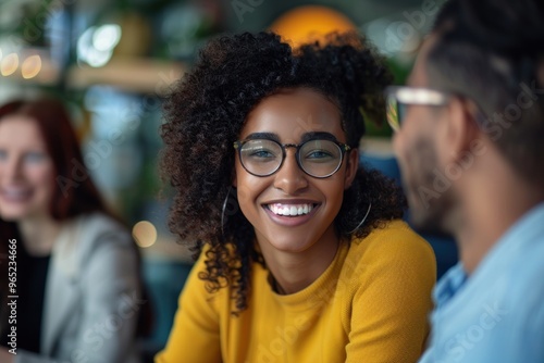 Close up Smiling diverse colleagues discussing project in office