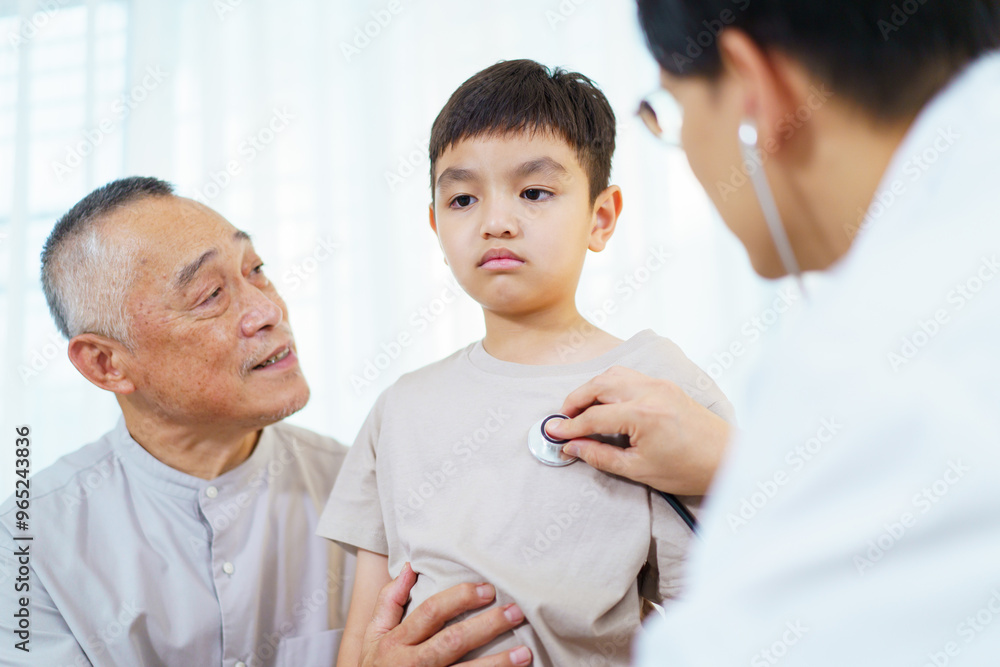 Grandfather taking his grandson to see doctor in hospital.