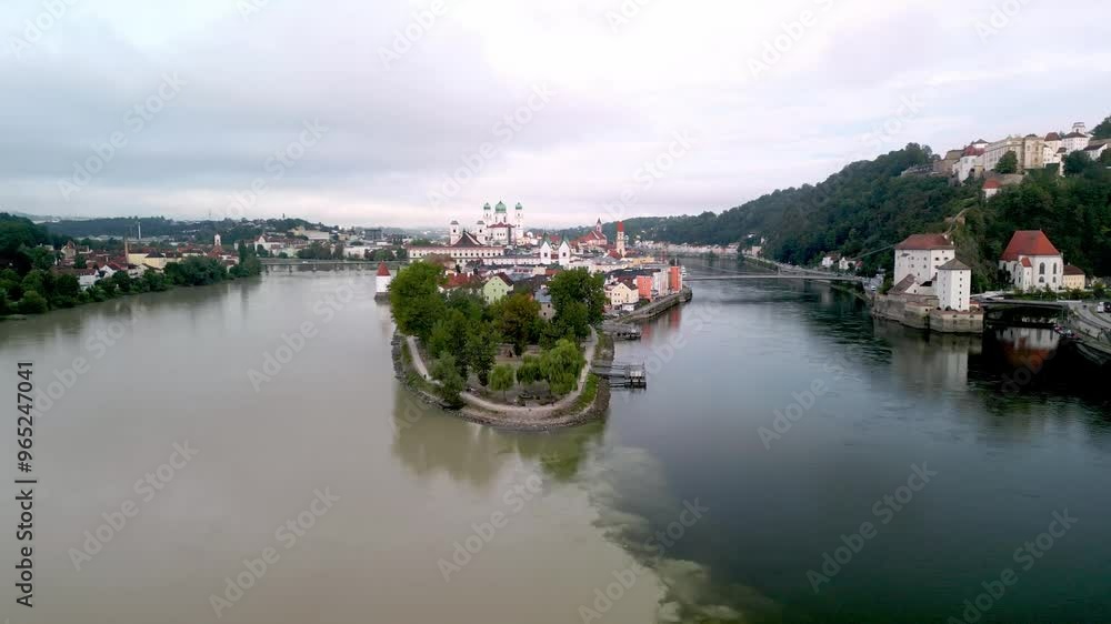Flying over confluence of three rivers, Inn, Danube and Ilz and over the city central parts with views over landmark buildings in Passau, Germany Flying over confluence of three rivers, Inn, Danube and Ilz and over the city central parts with views over landmark buildings in Passau, Germany