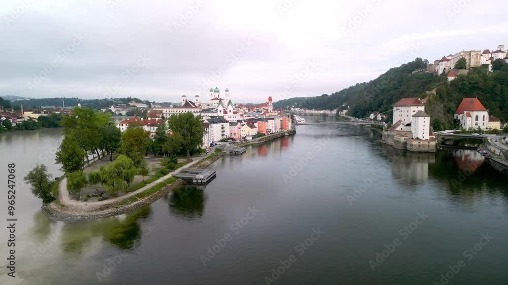 An aerial over confluence of three rivers, Danube, Inn, Ilz in Passau, Germany with early morning views over town. An aerial over confluence of three rivers, Danube, Inn, Ilz in Passau, Germany with early morning views over town.