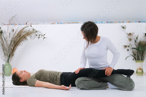 Teenager getting Shiatsu massage from Shiatsu masseuse