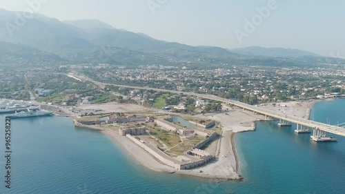 Dolly zoom. Patras, Greece. Rio Fortress. The Rio-Antirrio Bridge. Officially the Charilaos Trikoupis Bridge. Bridge over the Gulf of Corinth (Strait of Rion and Andirion), Aerial View, Departure of  photo