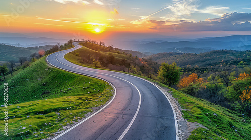 Scenic Winding Road through Lush Hills at Sunset