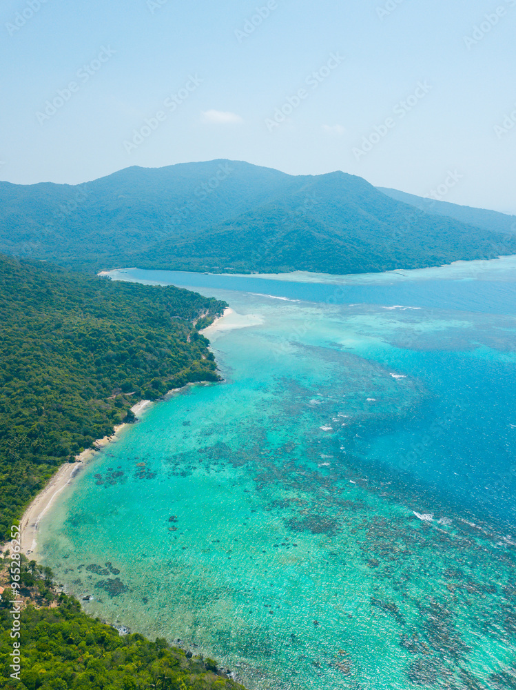 Nature landscape view of beautiful tropical beach and sea in sunny day. Beach sea space area. Summer vacation and summer holiday concept. Nature landscape view of beautiful tropical beach and sea in sunny day. Beach sea space area. Summer vacation and summer holiday concept.