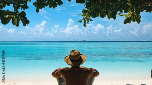 traveler gazing at crystalclear turquoise waters from pristine maldives beach resort photo