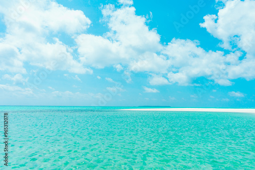 Fototapeta Naklejka Na Ścianę i Meble -  Nature tropical beach sea. Beautiful beach blue sea water. Blue sky background. Summer vacation and summer holiday concept.