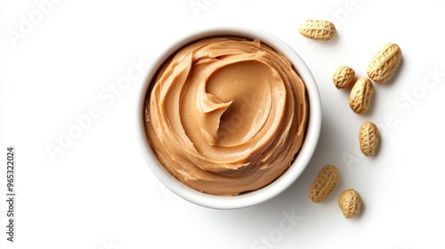 Bowl of peanut butter and peanuts isolated on white background. Top view