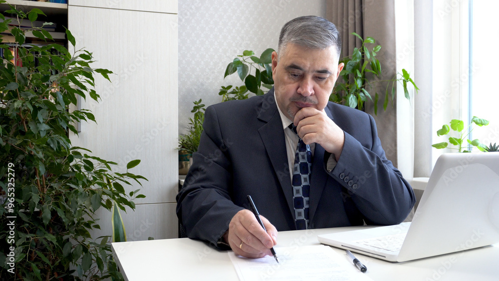Businessman at His Desk: Office Work Concept Businessman at His Desk: Office Work Concept
