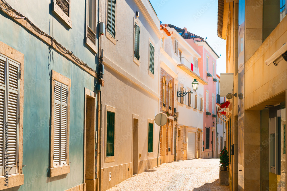 Old colorful architecture on the street in Cascais, Portugal. Beautiful cityscape at sunset.