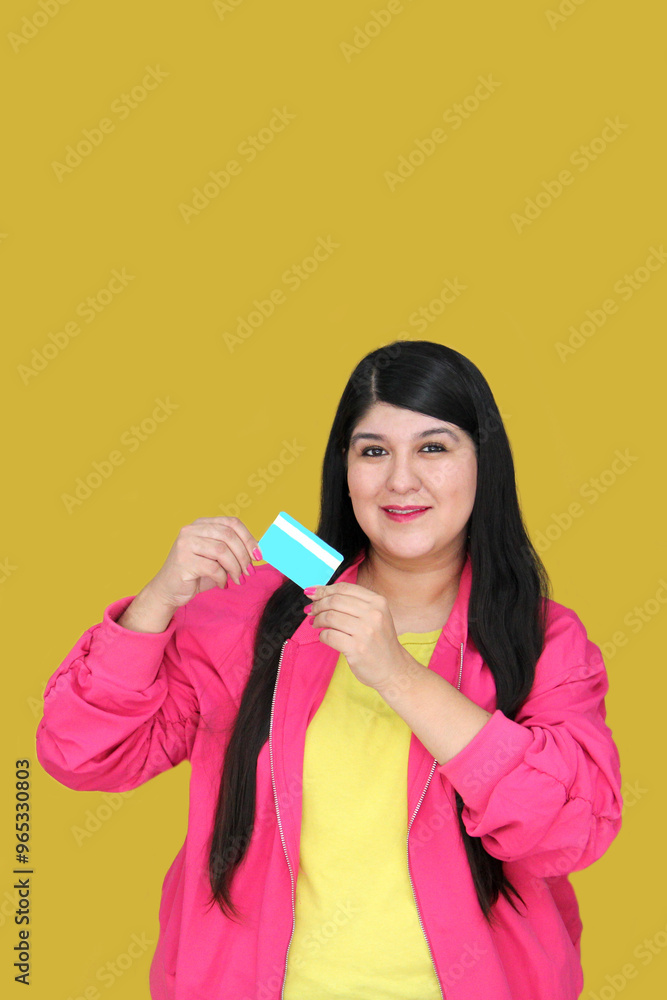 30 year old Latina woman excitedly shows credit card ready to buy with discounts and promotions 30 year old Latina woman excitedly shows credit card ready to buy with discounts and promotions