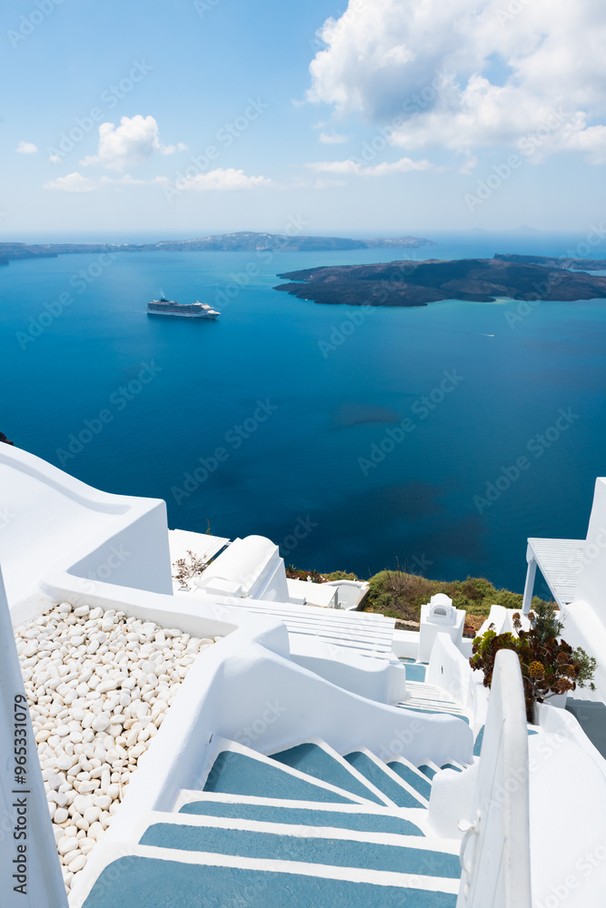 White architecture in Santorini island, Greece. Blue sea and the blue sky with clouds