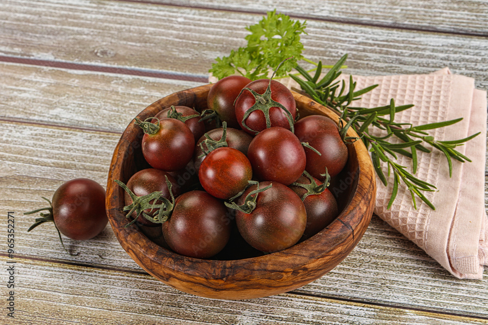 Juicy ripe black cherry tomato Juicy ripe black cherry tomato