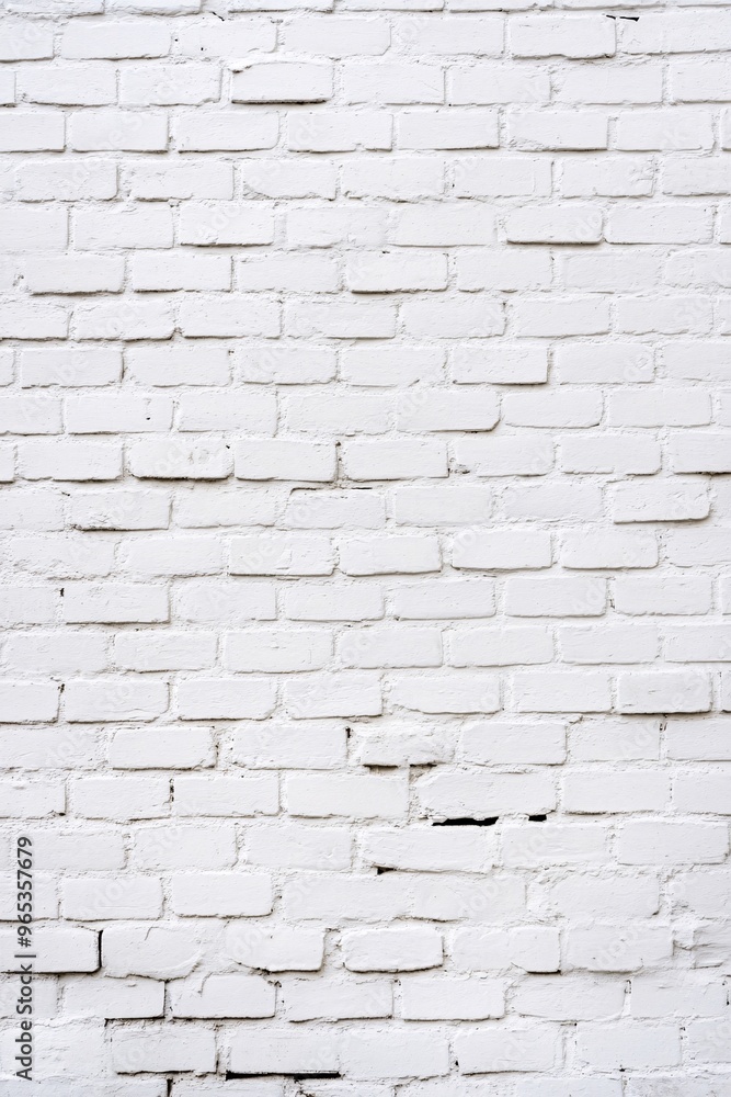 Naklejka premium Texture of white painted brick wall with rough surface and natural imperfections 