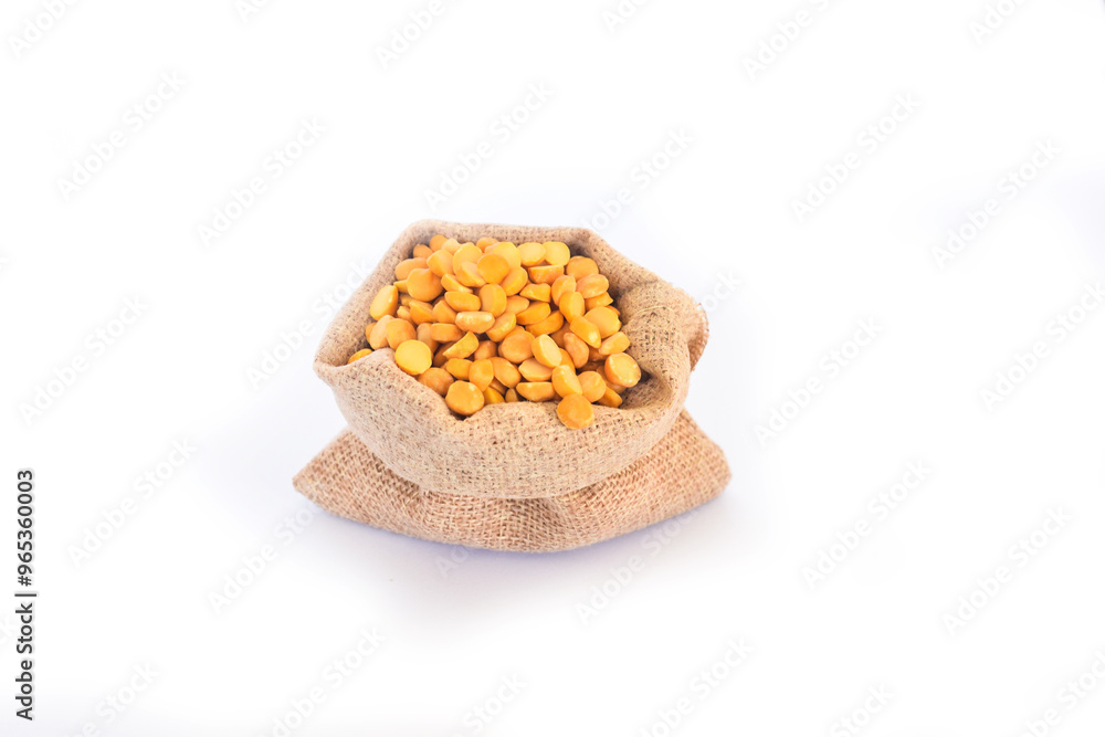 yellow seeds called Vicia Faba or Broad Beans like lupine on sale at the market. This legume can cause serious allergy to those predisposed, Yellow split peas in a bowl on a white background. yellow seeds called Vicia Faba or Broad Beans like lupine on sale at the market. This legume can cause serious allergy to those predisposed, Yellow split peas in a bowl on a white background.