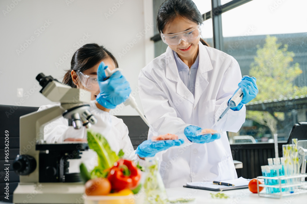 Food scientists in lab coats, testing samples, and analyzing food safety and quality in a laboratory Food scientists in lab coats, testing samples, and analyzing food safety and quality in a laboratory