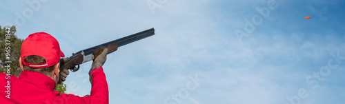  clay pigeon shooting in a shooting club, clay pigeon shooting on a trap with a gun, a man shoots clay pigeons outdoors, banner
