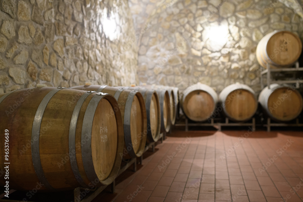 Wine cellar with oak barrels for aging wine. Traditional wine storage. Wine cellar with oak barrels for aging wine. Traditional wine storage.