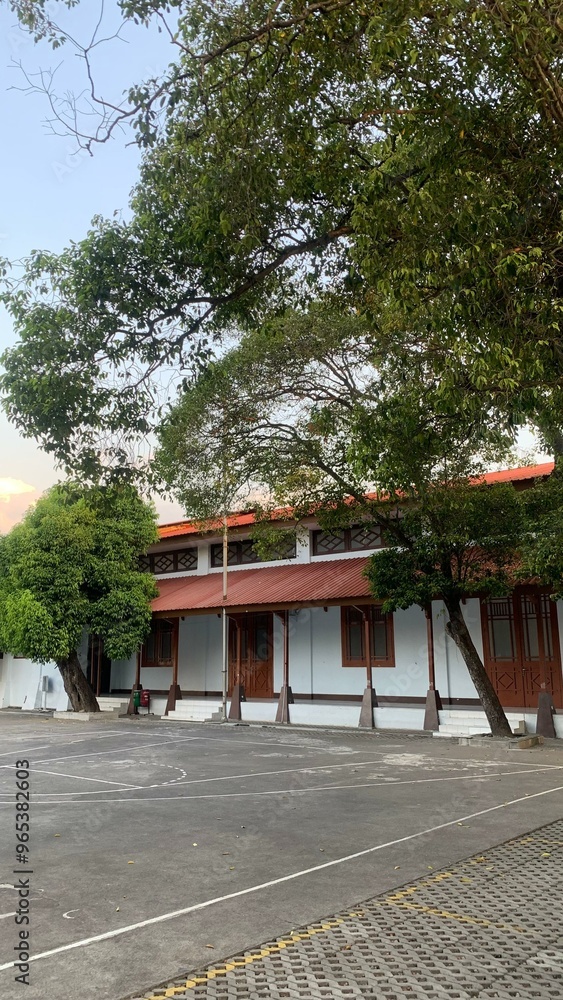Traditional Building with Trees and Empty Courtyard Traditional Building with Trees and Empty Courtyard