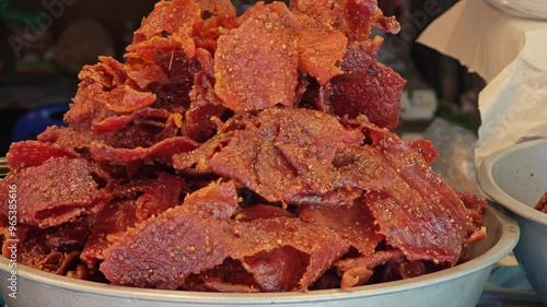 Sliced sheets of dried and sweet crispy pork. Thai style pork jerky , Sun dried pork. photo