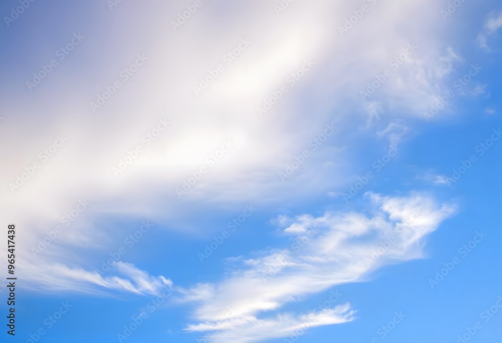 Obraz premium Clear blue sky with a single, fluffy white cloud drifting across it